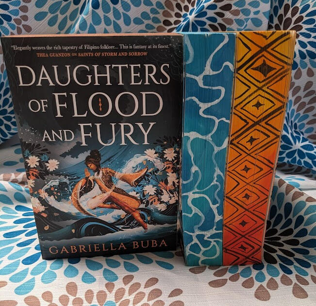 Images of 3 custom edge painted copies of Daughters of Flood and Fury